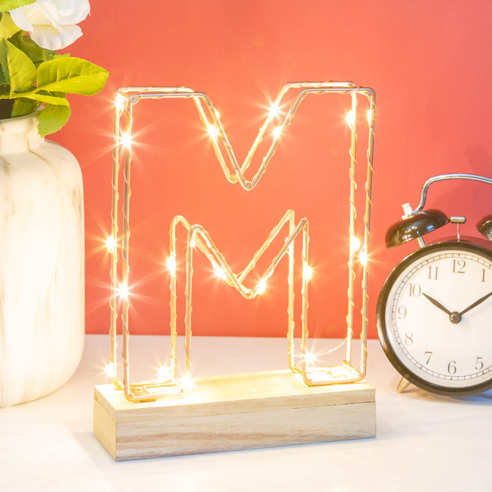 Single Illuminated Copper Rose Gold Wire Frame Letter M LED Light